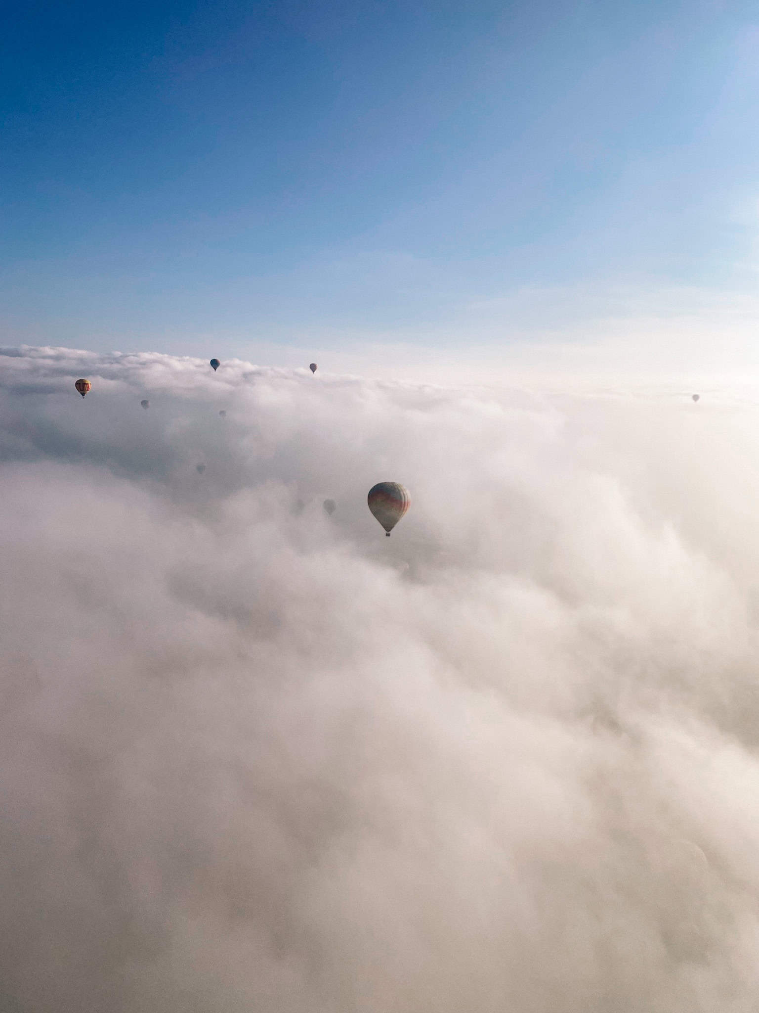 hot air balloon above the clouds